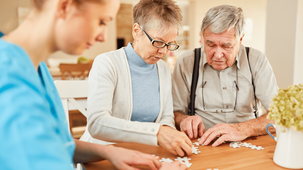 Dementia -Couple doing a jigsaw with a therapist